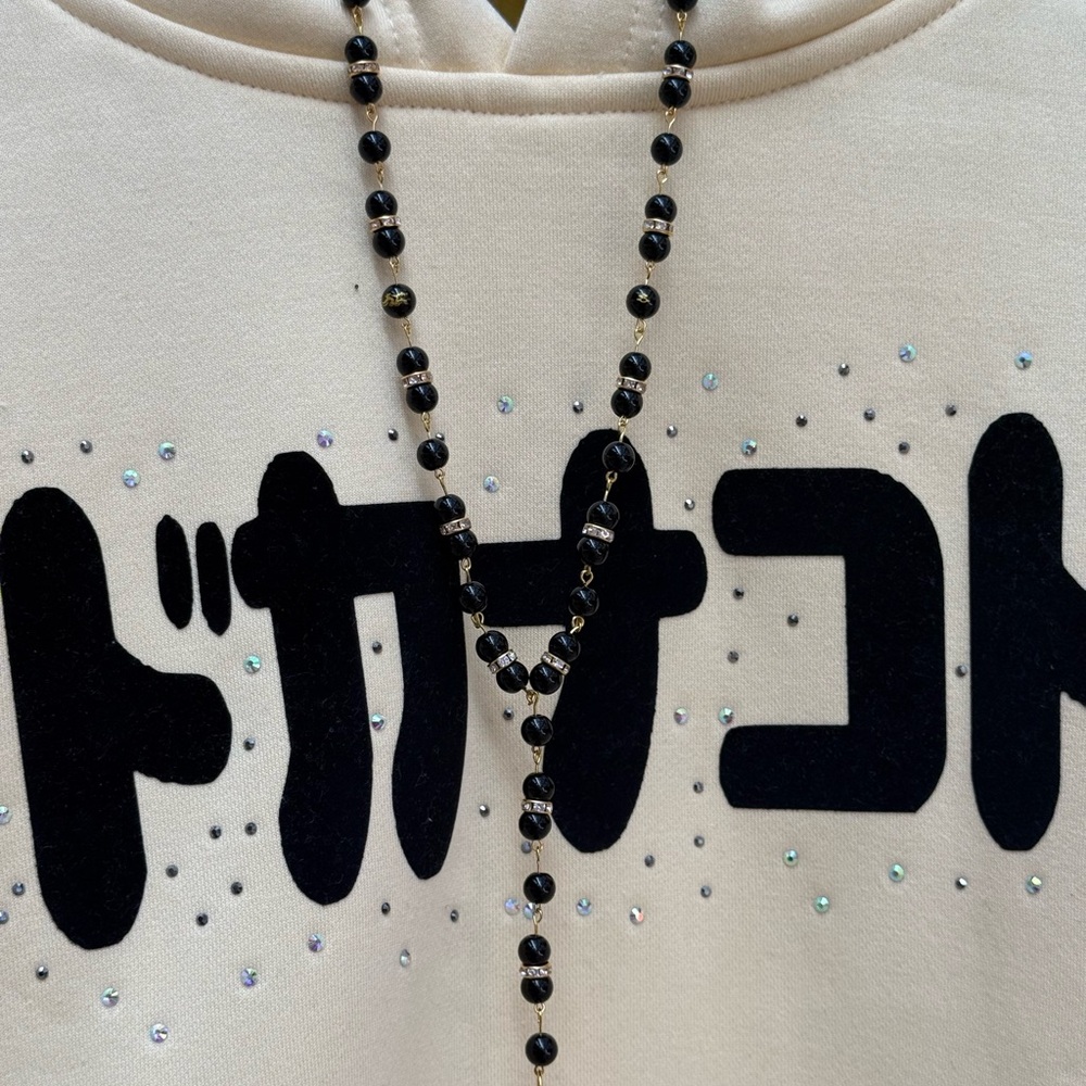 Cream Hoodie with Black Beaded Necklace